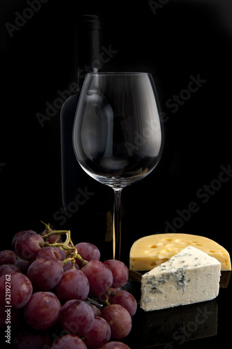 glass of wine with grapes and cheese