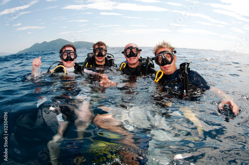 group of friends on surface before dive