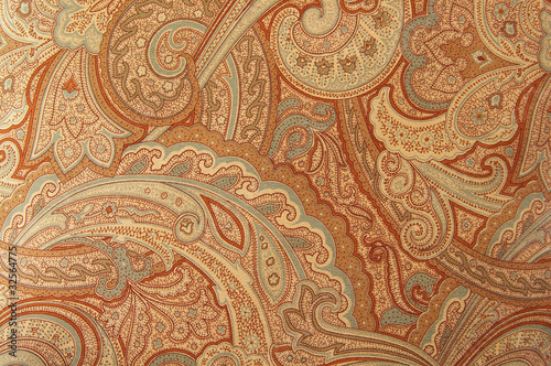 A brown paisley 70s style design pattern