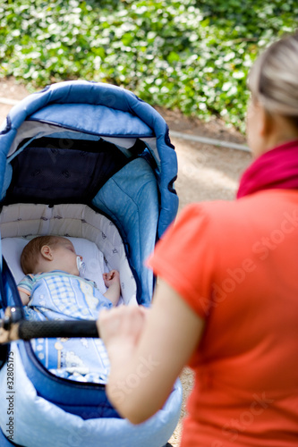 woman with pushing a pram