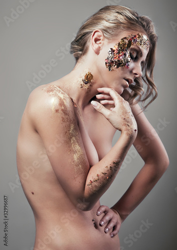 glamour style foto of blond woman with artistic makeup