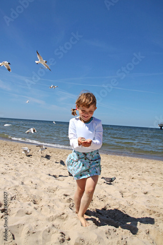 Girl playing on the beach