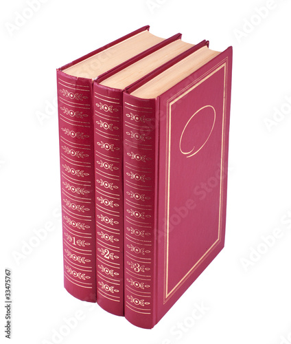 Vertical stack of three red books isolated over white