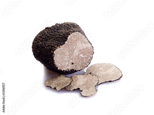 slice black truffle on white background