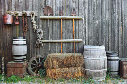 barrel bale and fork in old barn