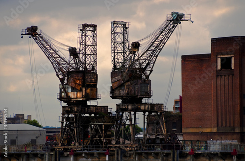 Two rusty cranes