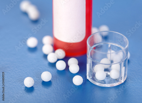 Homeopathic pills and plastic containers