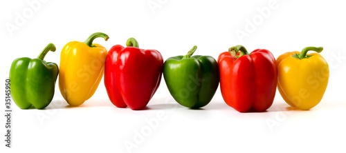 A lineup of colored peppers