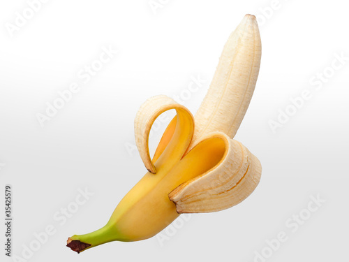 Полу очищенный банан с завитушкой