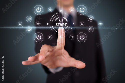 Businessman pressing simple type of start buttons
