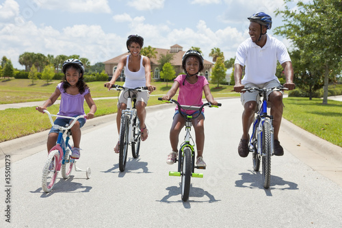 African American Family Parents and Children Cycling