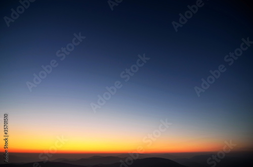 Colors of evening sky above the mountains