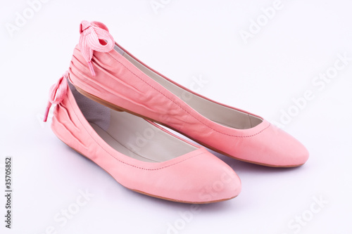 a pair of flat shoes