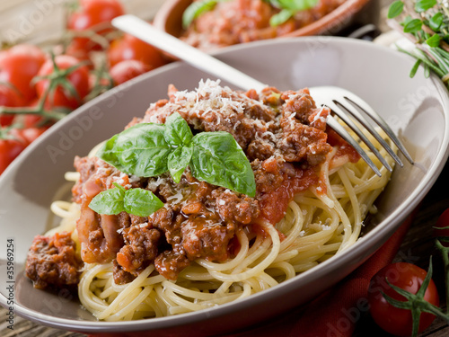 spaghetti bolognese with ragout sauce and parmesan cheese