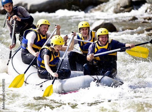 Group rowing on river