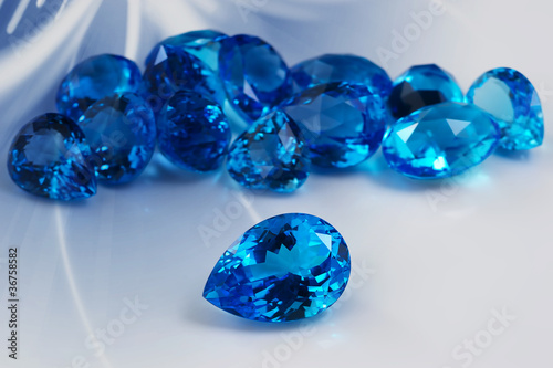 Group of topaz gemstones with artistic background.