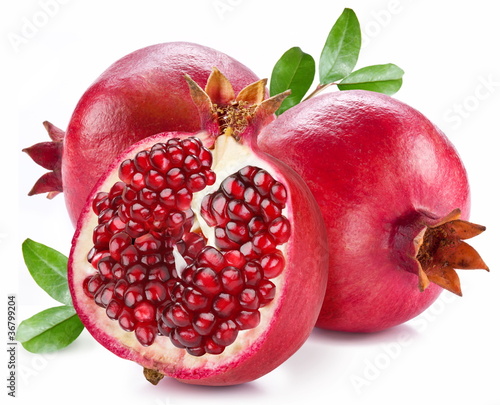 Ripe pomegranates with leaves.