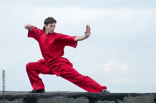 Wushoo man in red practice martial art