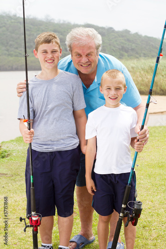 portrait of grandpa and grandsons fishing