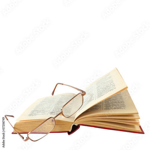 book and glasses on a white background