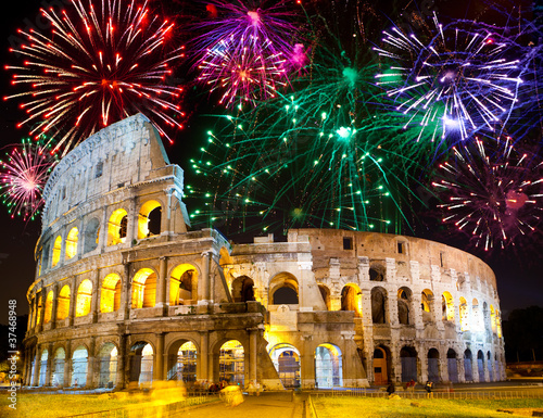 Celebratory fireworks over Collosseo. Italy. Rome.