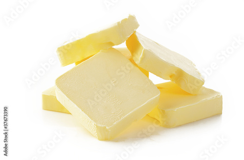 Piece of butter on white background