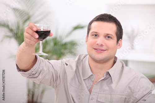 Man drinking wine alone