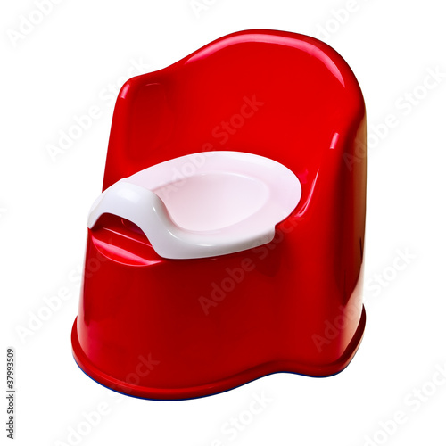 Red plastic baby potty isolated over white background.