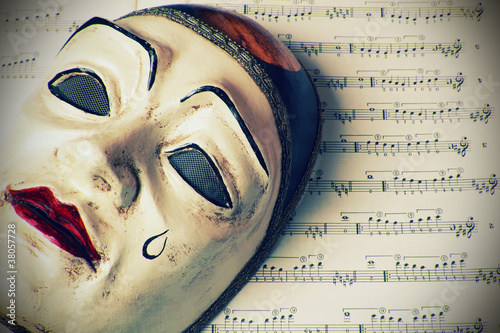 Pierrot mask over written music , retro styled