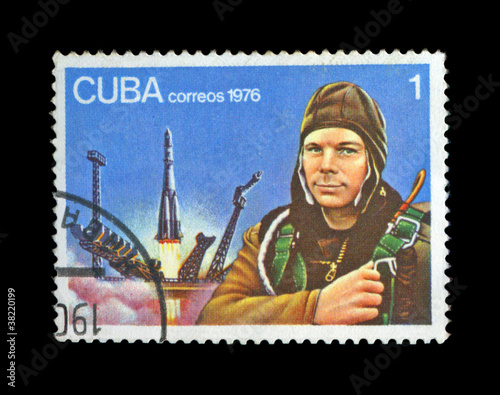 Yury Gagarin, First soviet astronaut, space-vehicle site, shuttle. vintage post stamp of Cuba isolated on black background.