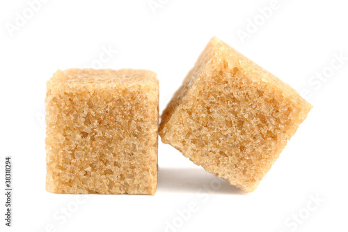 Cubes of cane sugar isolated on white background