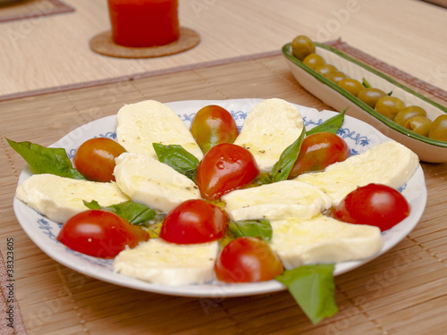 Italian salad with tomatos and mozarella cheese