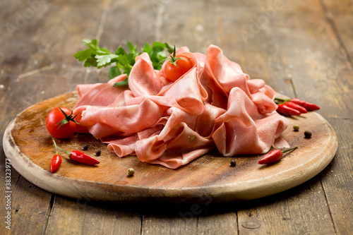 Mortadella slices with red pepper