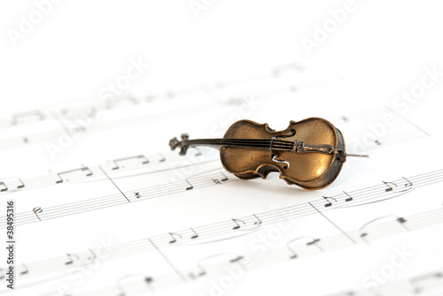Small classical instrument on note paper