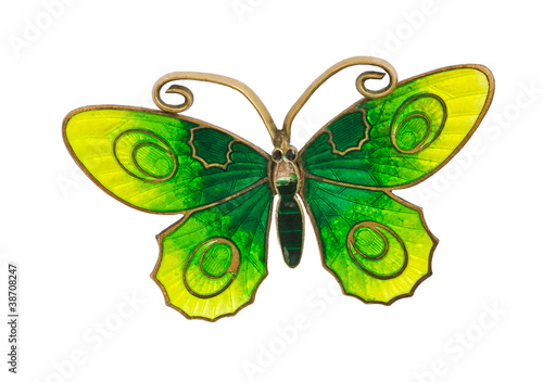 Old green and yellow butterfly brooch isolated