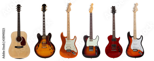 Group of six guitars on white background