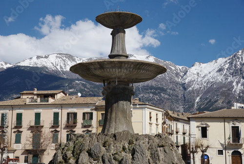 Sulmona, fountain and view over Apennine chain