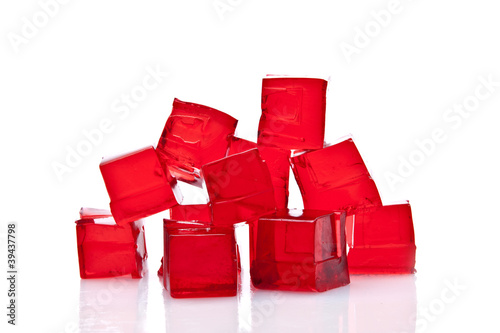 Cubes of red jelly on a white background