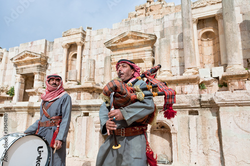 bedouin plays on bagpipes in ancient town Gerasa in Jordan