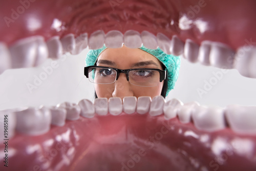 Dentist examining teeth.