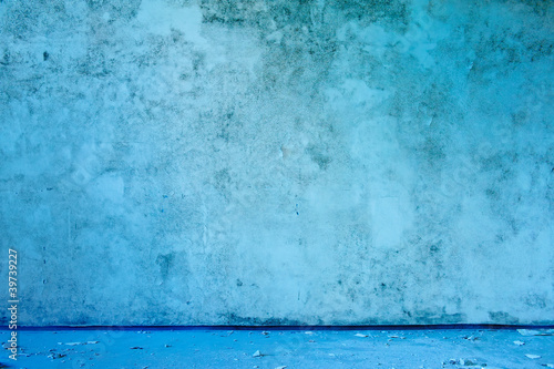 Old abandoned grungy blue wall