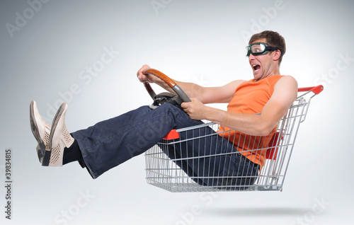 Unreal crazy driver in a shopping-cart with wheel