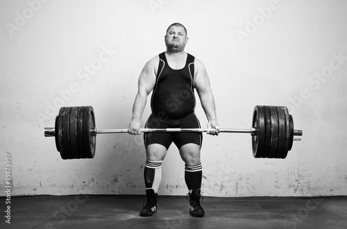 Champion Powerlifter with strong arms lifting weights