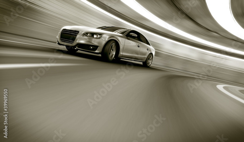 Car driving fast in tunnel