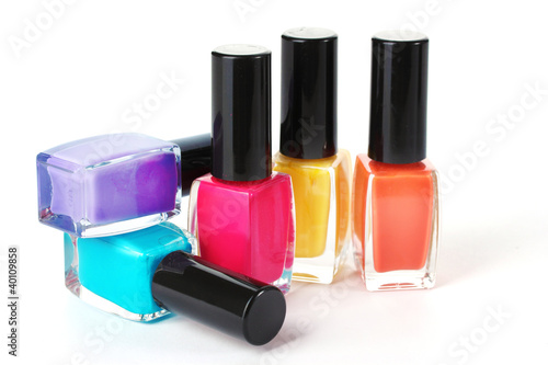 Group of bright nail polishes isolated on white