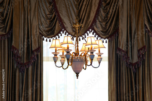 Chandelier and curtains of a luxury home window