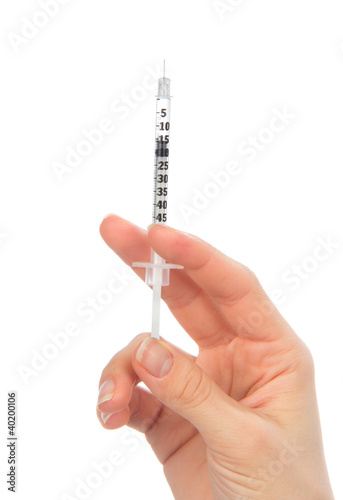 Doctor hand with medical insulin syringe in hand