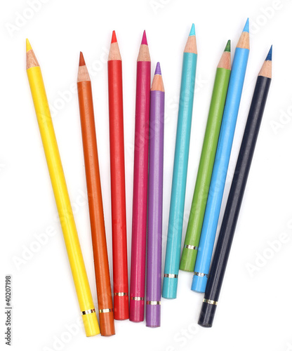 Color pencils over white background