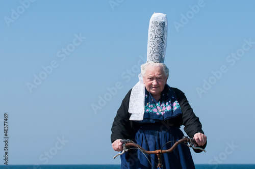 breton headdress under a blue sky