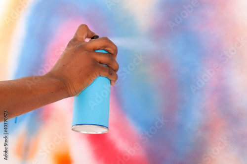 Spraying graffiti aerosol